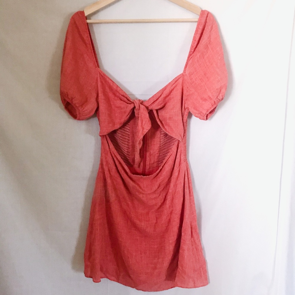 the jetset diaries // salmon pink tie cut out dress